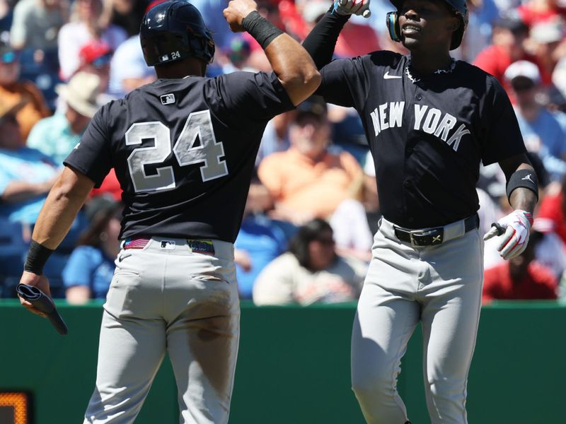 Mar 19, 2025; Clearwater, Florida, USA;  New York Yankees third base Jazz Chisholm Jr. (13) is congratulated by outfielder Jasson Dominguez (24) after he hit a 2-run home run during the third inning against the Philadelphia Phillies  at BayCare Ballpark. Mandatory Credit: Kim Klement Neitzel-Imagn Images