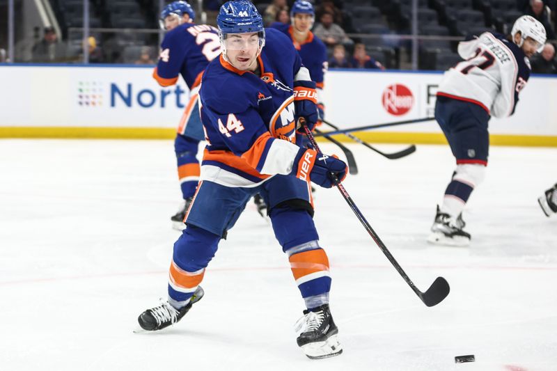 Jan 20, 2025; Elmont, New York, USA;  New York Islanders center Jean-Gabriel Pageau (44) passes the puck in the first period against the Columbus Blue Jackets at UBS Arena. Mandatory Credit: Wendell Cruz-Imagn Images