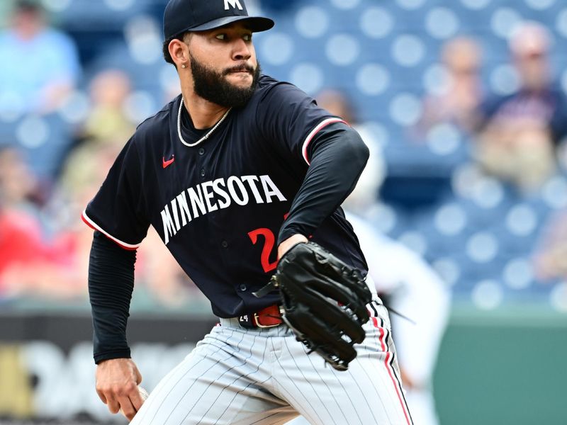 May 1, 2025; Cleveland, Ohio, USA; Minnesota Twins starting pitcher Simeon Woods Richardson (24) throws a pitch during the first inning against the Cleveland Guardians at Progressive Field. Mandatory Credit: Ken Blaze-Imagn Images

