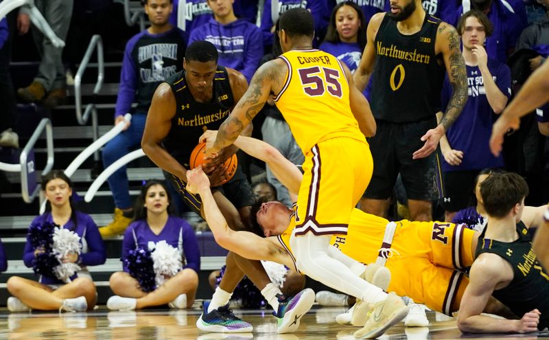 Jan 28, 2023; Evanston, Illinois, USA; Northwestern Wildcats guard Chase Audige (1) and Minnesota Golden Gophers center Treyton Thompson (42) struggle for the ball during the second half at Welsh-Ryan Arena. Mandatory Credit: David Banks-USA TODAY Sports