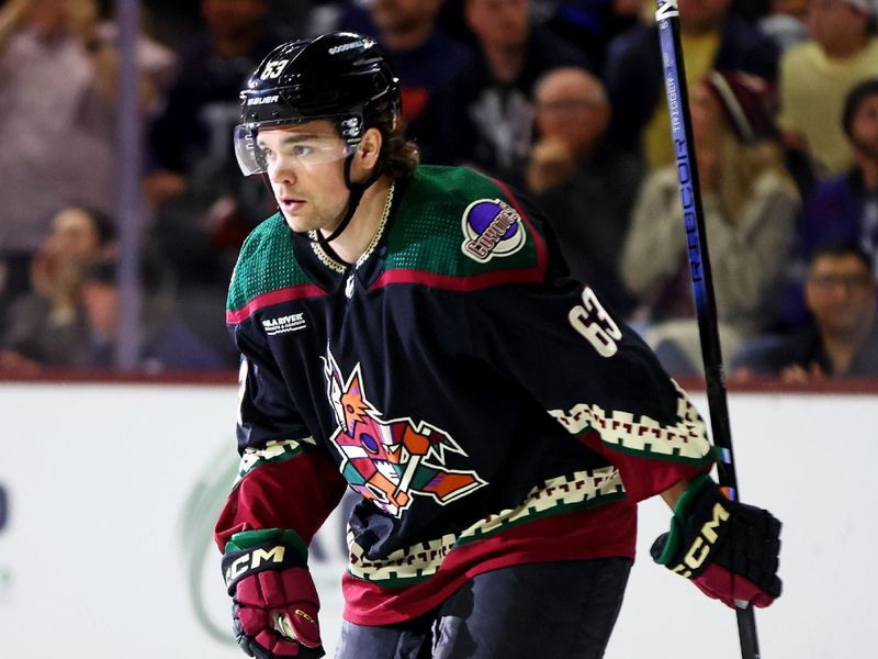 Feb 21, 2024; Tempe, Arizona, USA; Arizona Coyotes left wing Matias Maccelli (63) skates after scoring a goal during the second period against the Toronto Maple Leafs at Mullett Arena. Mandatory Credit: Mark J. Rebilas-USA TODAY Sports