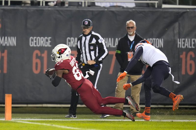 Arizona Cardinals wide receiver Greg Dortch scores on a pass from quarterback Kyler Murray during the second half of an NFL football game against the Chicago Bears Sunday, Dec. 24, 2023, in Chicago. (AP Photo/Erin Hooley)