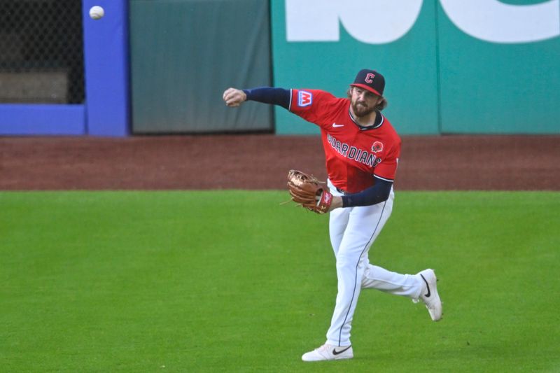 May 26, 2025; Cleveland, Ohio, USA; Cleveland Guardians right fielder Daniel Schneemann (10) throws the ball to the infield in the fifth inning against the Los Angeles Dodgers at Progressive Field. Mandatory Credit: David Richard-Imagn Images