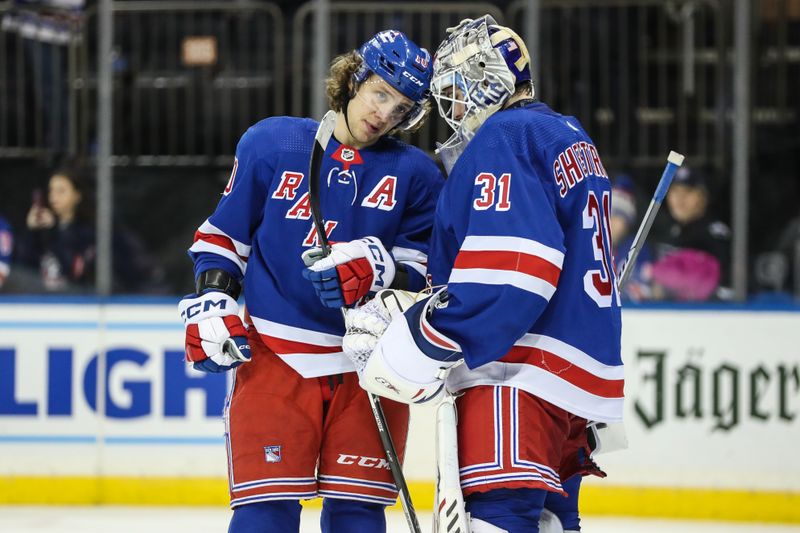 Nov 13, 2022; New York, New York, USA;  New York Rangers left wing Artemi Panarin (10) and goaltender Igor Shesterkin (31) celebrate after defeating the Arizona Coyotes 4-1 at Madison Square Garden. Mandatory Credit: Wendell Cruz-USA TODAY Sports