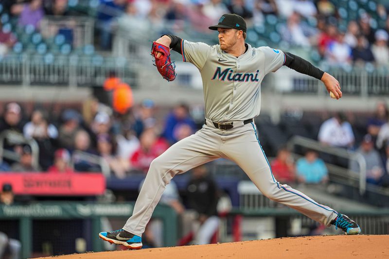 Apr 23, 2024; Cumberland, Georgia, USA; Miami Marlins pitcher Trevor Rogers (28) pitches against the Atlanta Braves during the first inning at Truist Park. Mandatory Credit: Dale Zanine-USA TODAY Sports