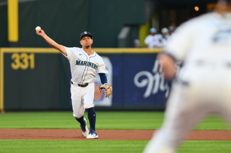 Aug 7, 2024; Seattle, Washington, USA; Seattle Mariners shortstop Leo Rivas (76) throws to first base during the fifth inning against the Detroit Tigers at T-Mobile Park. Mandatory Credit: Steven Bisig-USA TODAY Sports