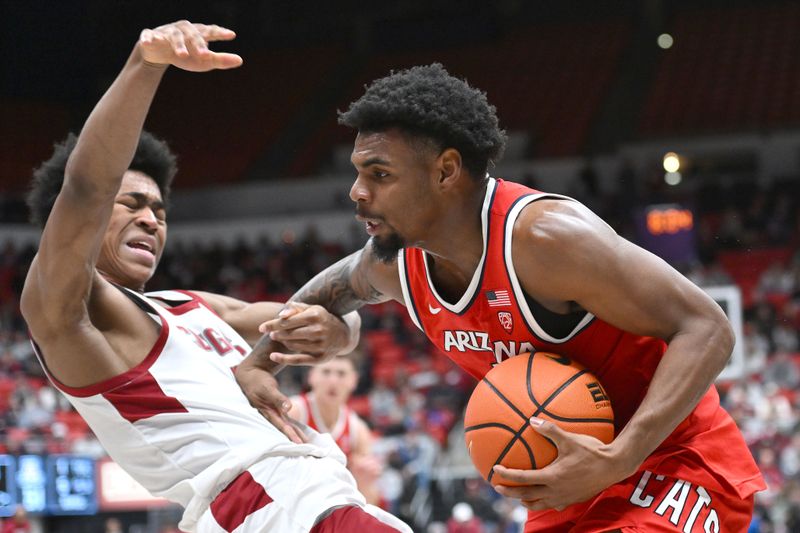 Jan 13, 2024; Pullman, Washington, USA; Washington State Cougars forward Jaylen Wells (0) takes the charges from Arizona Wildcats guard KJ Lewis (5) in the second half at Friel Court at Beasley Coliseum. Washington State won 73-70. Mandatory Credit: James Snook-USA TODAY Sports