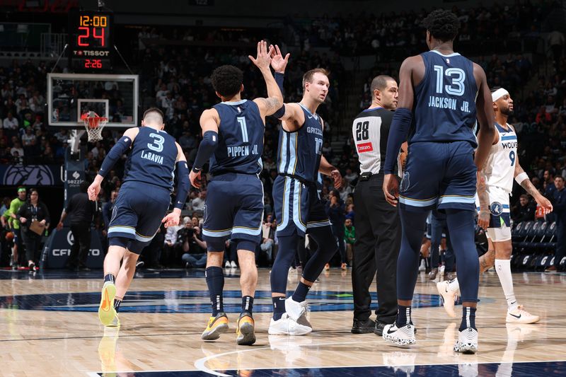 MINNEAPOLIS, MN -  JANUARY 11: Scotty Pippen Jr. #1 high fives Luke Kennard #10 of the Memphis Grizzlies  during the game against the Minnesota Timberwolves on January 11, 2025 at Target Center in Minneapolis, Minnesota. NOTE TO USER: User expressly acknowledges and agrees that, by downloading and or using this Photograph, user is consenting to the terms and conditions of the Getty Images License Agreement. Mandatory Copyright Notice: Copyright 2025 NBAE (Photo by David Sherman/NBAE via Getty Images)