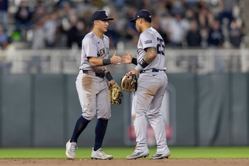 May 14, 2024; Minneapolis, Minnesota, USA; New York Yankees third baseman Oswaldo Cabrera (95) and second baseman Gleyber Torres (25) celebrate after defeating the Minnesota Twins at Target Field. Mandatory Credit: Jesse Johnson-USA TODAY Sports