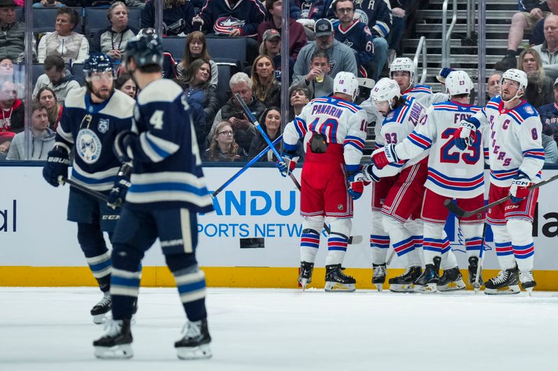 Nov 15, 2025; Columbus, Ohio, USA;  New York Rangers center Mika Zibanejad (93) celebrates with teammates after scoring a goal against the Columbus Blue Jackets in the second period at Nationwide Arena. Mandatory Credit: Aaron Doster-Imagn Images