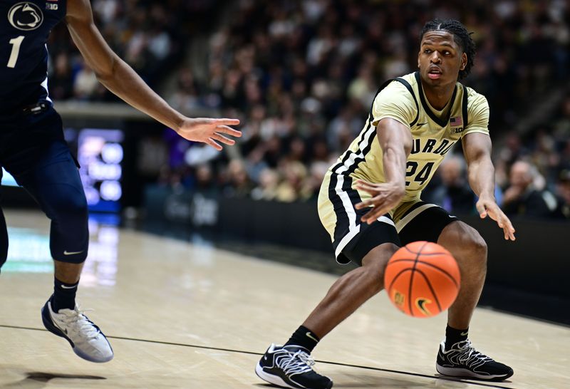 Jan 10, 2026; West Lafayette, Indiana, USA; Purdue Boilermakers guard Gicarri Harris (24) passes the ball around Penn State Nittany Lions forward Mason Blackwood (1) during the second half at Mackey Arena. Mandatory Credit: Marc Lebryk-Imagn Images