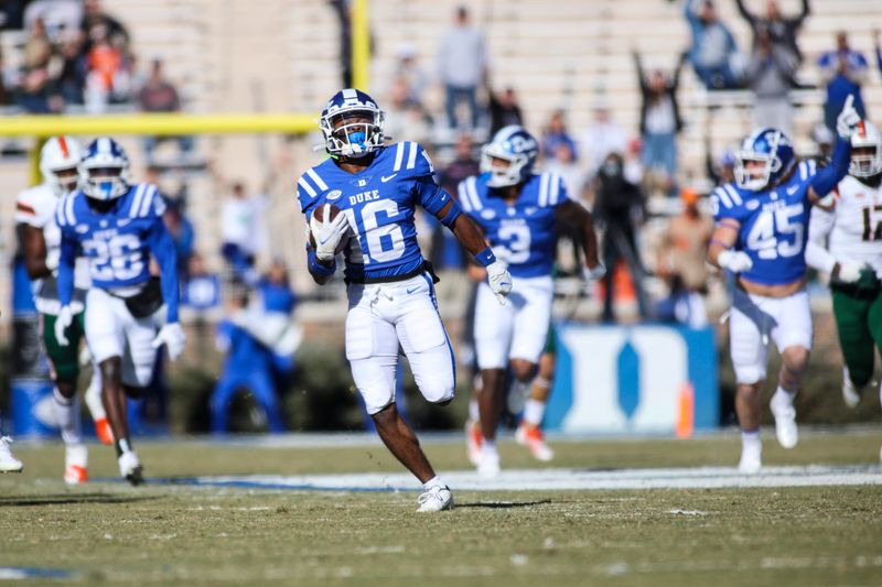 Nov 27, 2021; Durham, North Carolina, USA;  Duke Blue Devils quarterback Gavin Spurrier (16) runs with the ball to for a touchdown during the first half of the game against the Miami Hurricanes at Wallace Wade Stadium. at Wallace Wade Stadium. Mandatory Credit: Jaylynn Nash-USA TODAY Sports