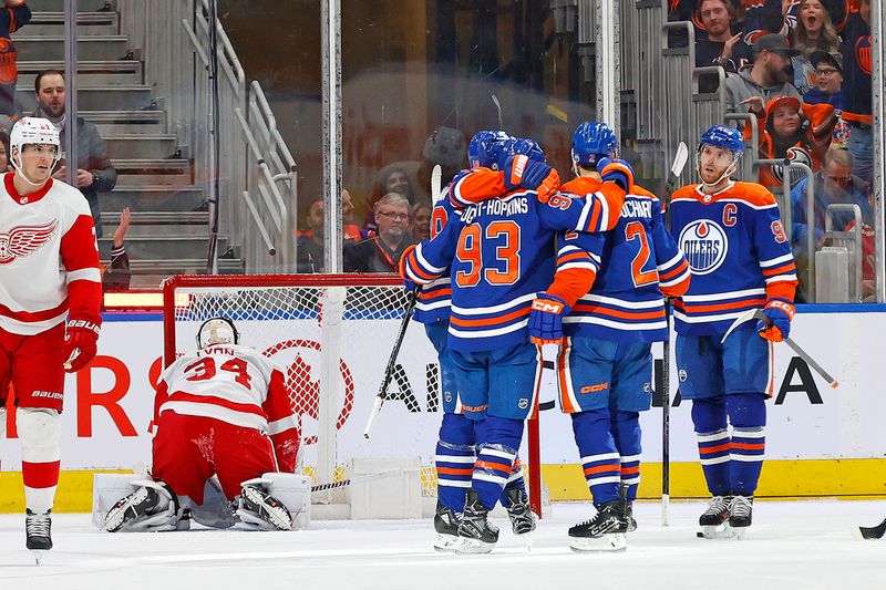 Feb 13, 2024; Edmonton, Alberta, CAN; The Edmonton Oilers celebrate a goal scored by defensemen Evan Bouchard (2) during the second period against the Detroit Red Wings at Rogers Place. Mandatory Credit: Perry Nelson-USA TODAY Sports