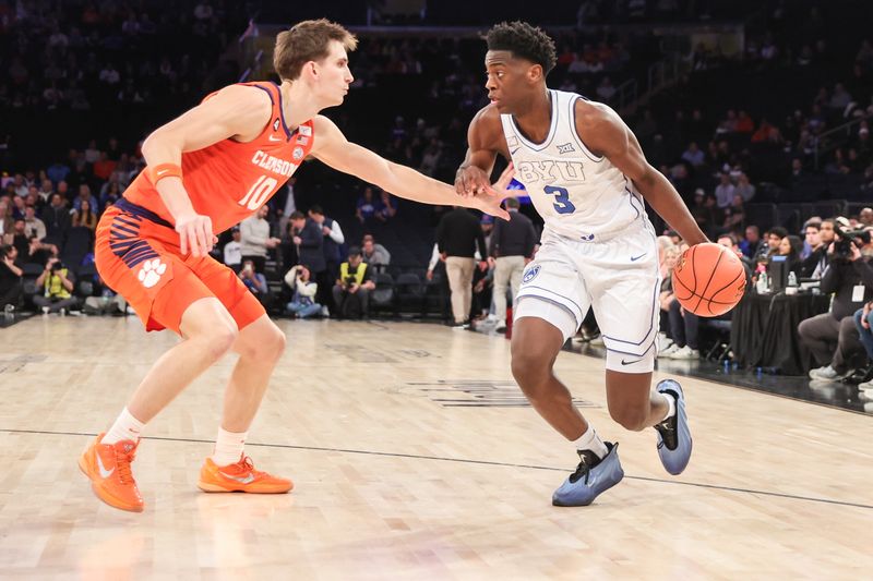 Dec 9, 2025; New York, New York, USA;  BYU Cougars forward AJ Dybantsa (3) looks to drive past Clemson Tigers forward Jake Wahlin (10) in the first half at Madison Square Garden. Mandatory Credit: Wendell Cruz-Imagn Images