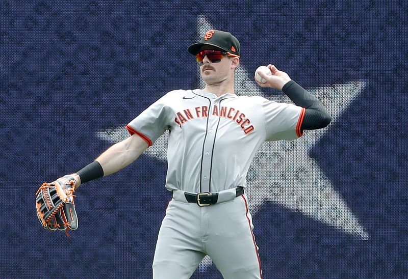 May 23, 2024; Pittsburgh, Pennsylvania, USA;  San Francisco Giants right fielder Mike Yastrzemski (5) warms up before the third inning against the Pittsburgh Pirates at PNC Park. Mandatory Credit: Charles LeClaire-USA TODAY Sports