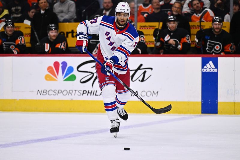 Nov 24, 2023; Philadelphia, Pennsylvania, USA; New York Rangers defenseman K'Andre Miller (79) passes the puck against the Philadelphia Flyers in the first period at Wells Fargo Center. Mandatory Credit: Kyle Ross-USA TODAY Sports