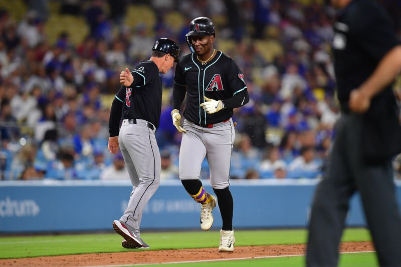 May 19, 2025; Los Angeles, California, USA; Arizona Diamondbacks shortstop Geraldo Perdomo (2) rounds the bases after hitting a solo home run against the Los Angeles Dodgers during the eighth inning at Dodger Stadium. Mandatory Credit: Gary A. Vasquez-Imagn Images