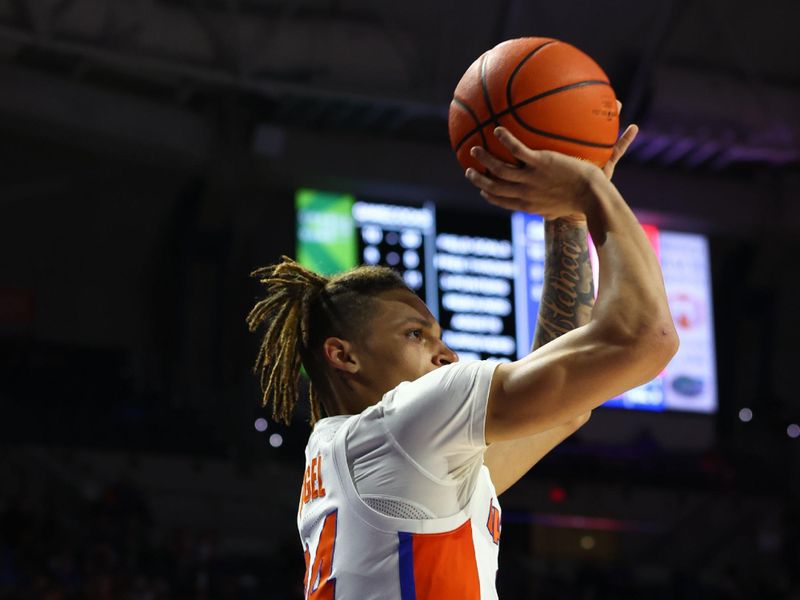 Jan 25, 2023; Gainesville, Florida, USA; Florida Gators guard Riley Kugel (24) makes a three point basket against the South Carolina Gamecocks during the second half at Exactech Arena at the Stephen C. O'Connell Center. Mandatory Credit: Kim Klement-USA TODAY Sports