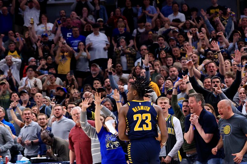 INDIANAPOLIS, INDIANA - MARCH 13: Aaron Nesmith #23 of the Indiana Pacers brings the ball up the court as fans celebrate during the fourth quarter in the game against the Chicago Bulls at Gainbridge Fieldhouse on March 13, 2024 in Indianapolis, Indiana. NOTE TO USER: User expressly acknowledges and agrees that, by downloading and or using this photograph, User is consenting to the terms and conditions of the Getty Images License Agreement. (Photo by Justin Casterline/Getty Images)