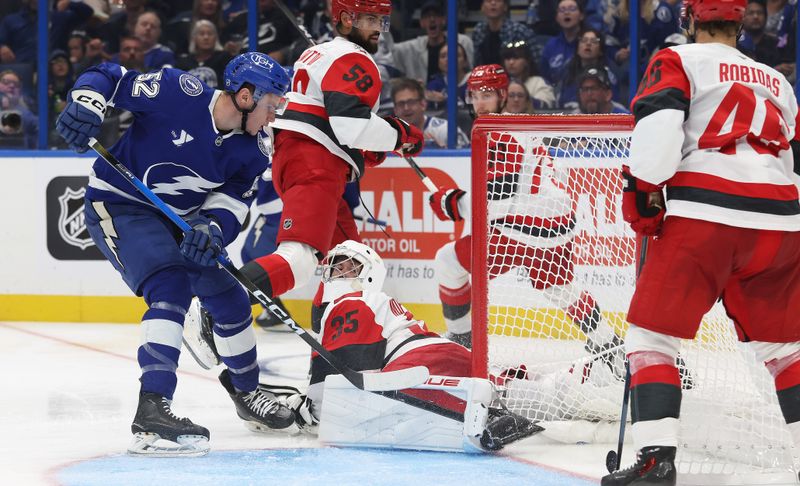 Sep 26, 2025; Tampa, Florida, USA; Tampa Bay Lightning defenseman Maxim Groshev (52) shoots and scores a goal against the Carolina Hurricanes during the third period at Benchmark International Arena. Mandatory Credit: Kim Klement Neitzel-Imagn Images