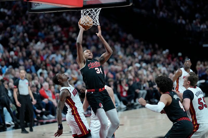 PORTLAND, OREGON - FEBRUARY 27: Jabari Walker #34 of the Portland Trail Blazers shoots the ball against Terry Rozier #2 (L) of the Miami Heat during the second half at Moda Center on February 27, 2024 in Portland, Oregon. NOTE TO USER: User expressly acknowledges and agrees that, by downloading and or using this photograph, User is consenting to the terms and conditions of the Getty Images License Agreement. (Photo by Soobum Im/Getty Images)