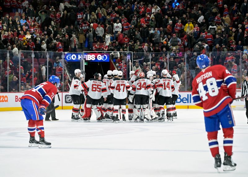 Jan 25, 2025; Montreal, Quebec, CAN;  The New Jersey Devils celebrates the win against the Montreal Canadiens during the overtime period at the Bell Centre. Mandatory Credit: Eric Bolte-Imagn Images