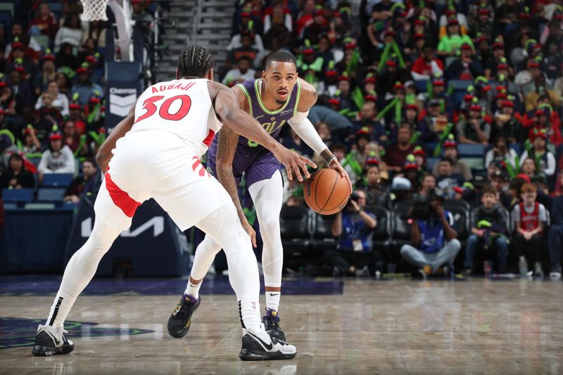 NEW ORLEANS, LA - NOVEMBER 27: Dejounte Murray #5 of the New Orleans Pelicans dribbles the ball during the game against the Toronto Raptors  during a regular season game on November 27, 2024 at the Smoothie King Center in New Orleans, Louisiana. NOTE TO USER: User expressly acknowledges and agrees that, by downloading and or using this Photograph, user is consenting to the terms and conditions of the Getty Images License Agreement. Mandatory Copyright Notice: Copyright 2024 NBAE (Photo by Layne Murdoch Jr./NBAE via Getty Images)