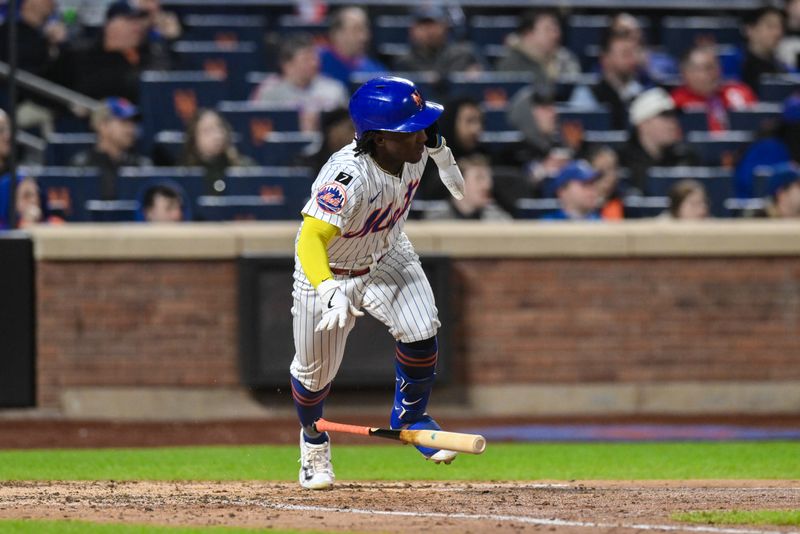 Apr 21, 2025; New York City, New York, USA; New York Mets second baseman Luisangel Acuña (2) hits a single against the Philadelphia Phillies during the seventh inning at Citi Field. Mandatory Credit: John Jones-Imagn Images