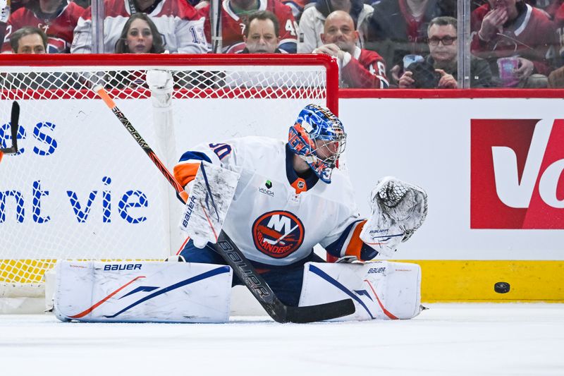 Mar 21, 2026; Montreal, Quebec, CAN; New York Islanders goalie Ilya Sorokin (30) tracks a shot against the Montreal Canadiens during the second period at Bell Centre. Mandatory Credit: David Kirouac-Imagn Images