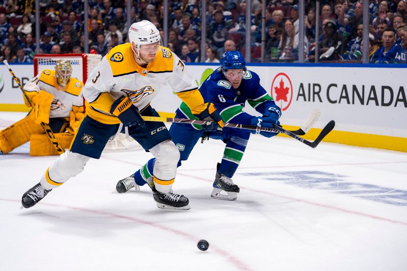 Apr 23, 2024; Vancouver, British Columbia, CAN; Nashville Predators defenseman Jeremy Lauzon (3) battles for the loose puck with Vancouver Canucks forward Brock Boeser (6) during the first period in game two of the first round of the 2024 Stanley Cup Playoffs at Rogers Arena. Mandatory Credit: Bob Frid-USA TODAY Sports