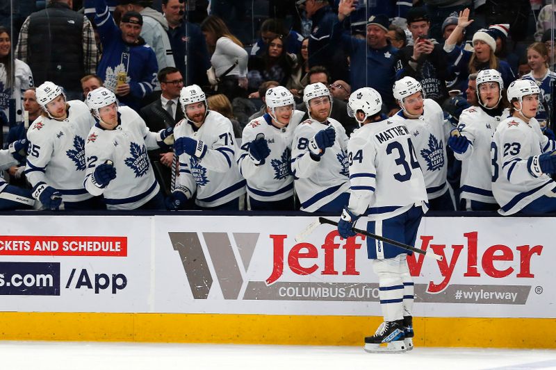 Dec 23, 2023; Columbus, Ohio, USA; Toronto Maple Leafs center Auston Matthews (34) celebrates his goal against the Columbus Blue Jackets during the second period at Nationwide Arena. Mandatory Credit: Russell LaBounty-USA TODAY Sports