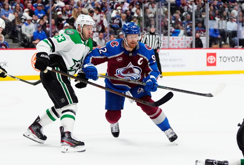 May 1, 2025; Denver, Colorado, USA; Dallas Stars right wing Evgenii Dadonov (63) defends on Colorado Avalanche left wing Gabriel Landeskog (92) in the second period in game six of the first round of the 2025 Stanley Cup Playoffs at Ball Arena. Mandatory Credit: Ron Chenoy-Imagn Images