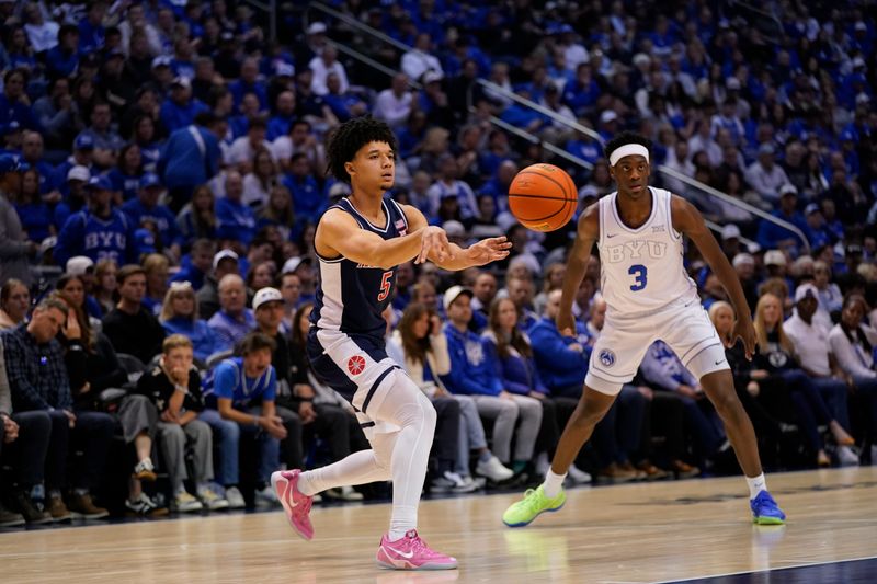 Jan 26, 2026; Provo, Utah, USA; Arizona Wildcats guard Brayden Burries (5) passes the ball during the first half against the Arizona Wildcats at Marriott Center. Mandatory Credit: Aaron Baker-Imagn Images 