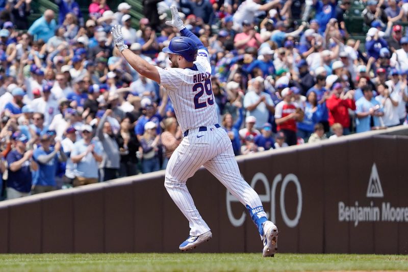 Jun 1, 2025; Chicago, Illinois, USA; Chicago Cubs first base Michael Busch (29) gestures after hitting a two-run home run against the Cincinnati Reds during the third inning at Wrigley Field. Mandatory Credit: David Banks-Imagn Images