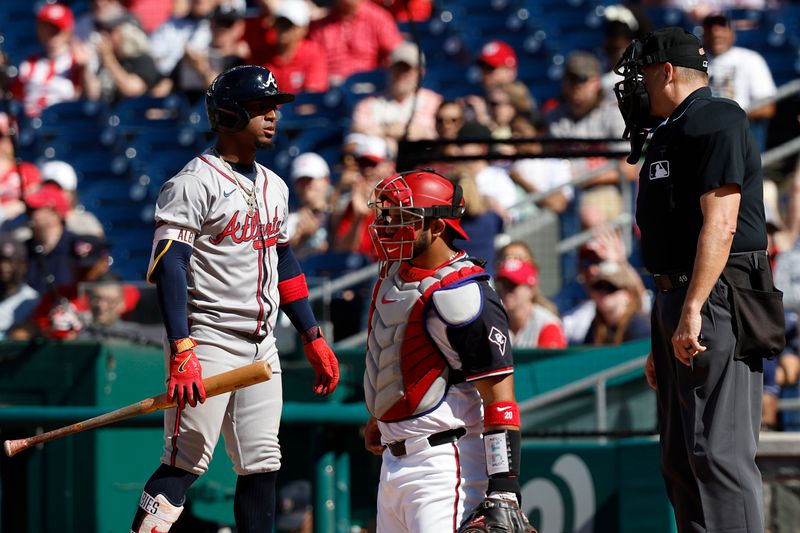 Jun 9, 2024; Washington, District of Columbia, USA; Atlanta Braves second baseman Ozzie Albies (1) argues with home plate umpire Andy Fletcher (49) after a called strike against the Washington Nationals during the ninth inning at Nationals Park. Mandatory Credit: Geoff Burke-USA TODAY Sports