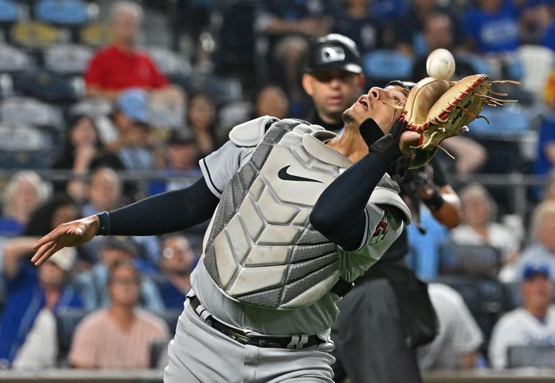 Sep 19, 2023; Kansas City, Missouri, USA; Cleveland Guardians catcher Bo Naylor (23) catches a foul pop fly in the seventh inning against the Kansas City Royals at Kauffman Stadium. Mandatory Credit: Peter Aiken-USA TODAY Sports