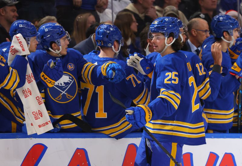 Dec 21, 2023; Buffalo, New York, USA;  Buffalo Sabres defenseman Owen Power (25) celebrates his goal with teammates during the first period against the Toronto Maple Leafs at KeyBank Center. Mandatory Credit: Timothy T. Ludwig-USA TODAY Sports