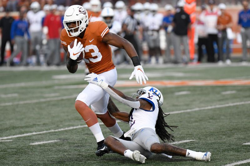 Oct 19, 2019; Austin, TX, USA; Texas Longhorns wide receiver Brennan Eagles (13) runs after after catching a pass against Kansas Jayhawks cornerback Corione Harris (2) in the first half at Darrell K Royal-Texas Memorial Stadium. Mandatory Credit: Scott Wachter-USA TODAY Sports