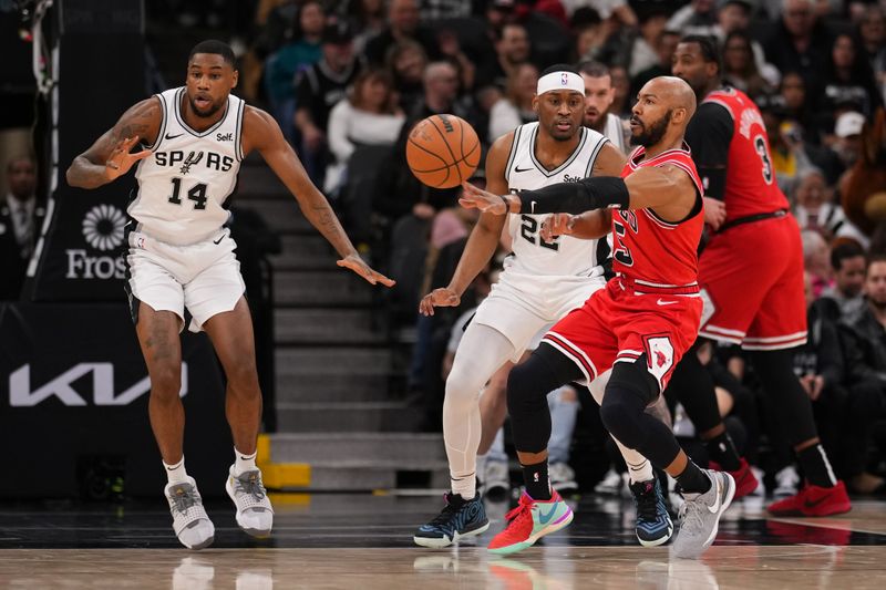 SAN ANTONIO, TX - JANUARY 13: Jevon Carter #5 of the Chicago Bulls passes the ball during the game against the San Antonio Spurs on January 13, 2024 at the Frost Bank Center in San Antonio, Texas. NOTE TO USER: User expressly acknowledges and agrees that, by downloading and or using this photograph, user is consenting to the terms and conditions of the Getty Images License Agreement. Mandatory Copyright Notice: Copyright 2024 NBAE (Photos by Darren Carroll/NBAE via Getty Images)