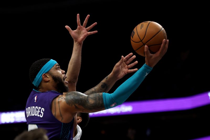 CHARLOTTE, NORTH CAROLINA - DECEMBER 23: Miles Bridges #0 of the Charlotte Hornets shoots the ball during the first half of an NBA game against the Denver Nuggets at Spectrum Center on December 23, 2023 in Charlotte, North Carolina. NOTE TO USER: User expressly acknowledges and agrees that, by downloading and or using this photograph, User is consenting to the terms and conditions of the Getty Images License Agreement. (Photo by David Jensen/Getty Images)