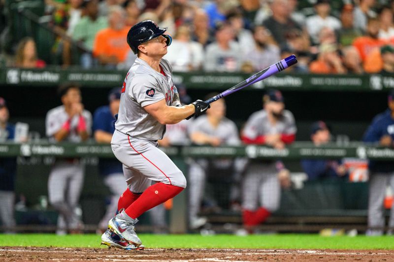 Aug 17, 2024; Baltimore, Maryland, USA; Boston Red Sox outfielder Tyler O'Neill (17) hits a single during the eighth inning against the Baltimore Orioles at Oriole Park at Camden Yards. Mandatory Credit: Reggie Hildred-USA TODAY Sports