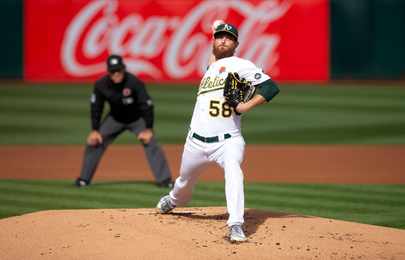 May 29, 2023; Oakland, California, USA; Oakland Athletics starting pitcher Paul Blackburn (58) delivers a pitch against the Atlanta Braves during the first inning at Oakland-Alameda County Coliseum. Mandatory Credit: D. Ross Cameron-USA TODAY Sports