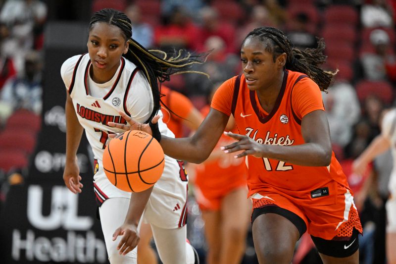 Jan 4, 2026; Louisville, Kentucky, USA;  Virginia Tech Hokies guard Samyha Suffren (12) dribbles against Louisville Cardinals guard Tajianna Roberts (22) during the second half at KFC Yum! Center. Louisville defeated Virginia Tech 85-60. Mandatory Credit: Jamie Rhodes-Imagn Images