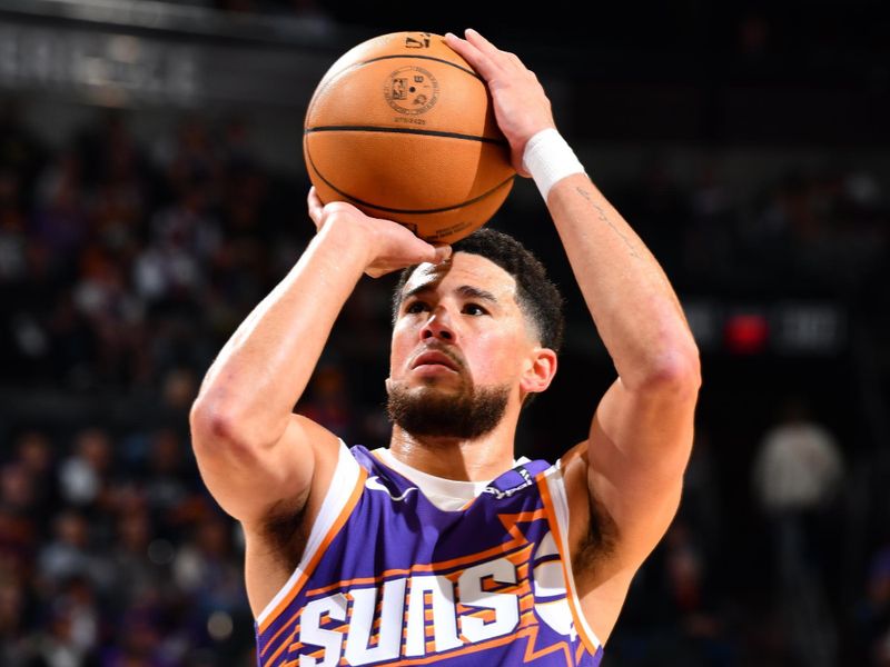 PHOENIX, AZ - NOVEMBER 2: Devin Booker #1 of the Phoenix Suns shoots a free throw during the game against the Portland Trail Blazers on November 2, 2024 at Footprint Center in Phoenix, Arizona. NOTE TO USER: User expressly acknowledges and agrees that, by downloading and or using this photograph, user is consenting to the terms and conditions of the Getty Images License Agreement. Mandatory Copyright Notice: Copyright 2024 NBAE (Photo by Barry Gossage/NBAE via Getty Images)