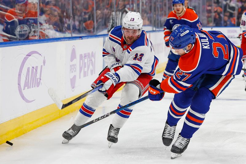 Nov 23, 2024; Edmonton, Alberta, CAN; Edmonton Oilers defensemen Brett Kulak (27)  and New York Rangers forward Alexis Lafreniere (13) battle along the boards for a loose puck during the second period at Rogers Place. Mandatory Credit: Perry Nelson-Imagn Images