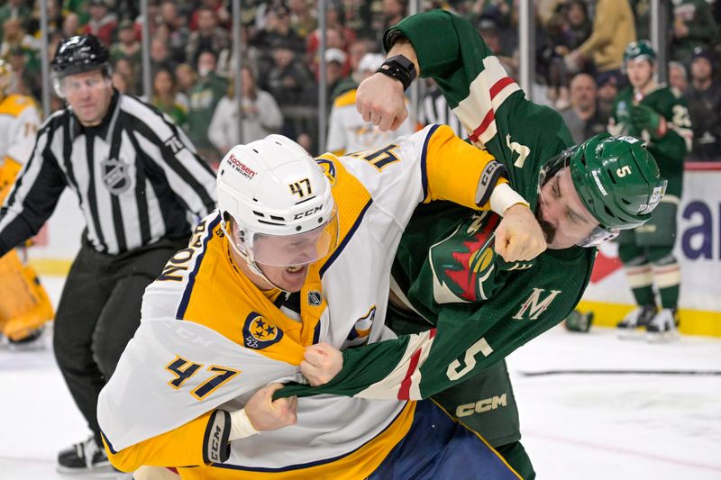 Jan 25, 2024; Saint Paul, Minnesota, USA; Nashville Predators forward Michael McCarron (47) and Minnesota Wild defenseman Jacob Middleton (5) fight during the second period at Xcel Energy Center. Mandatory Credit: Nick Wosika-USA TODAY Sports