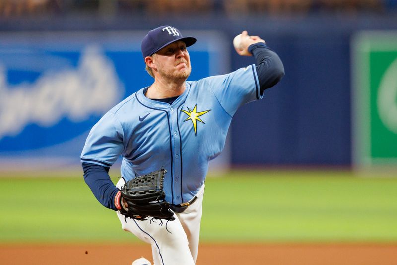 Jun 9, 2024; St. Petersburg, Florida, USA;  Tampa Bay Rays pitcher Garrett Cleavinger (60) throws a pitch against the Baltimore Orioles in the seventh inning at Tropicana Field. Mandatory Credit: Nathan Ray Seebeck-USA TODAY Sports