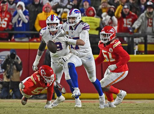 Buffalo Bills quarterback Josh Allen (17) runs up field for a first down during the AFC Championship NFL football game against the Kansas City Chiefs Sunday, Jan. 26, 2025, in Kansas City, Mo. (AP Photo/Peter Aiken)