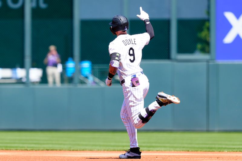Apr 10, 2025; Denver, Colorado, USA; Colorado Rockies center fielder Brenton Doyle (9) rounds the bases after a solo home run in the first inning against the Milwaukee Brewers at Coors Field. Mandatory Credit: Ron Chenoy-Imagn Images