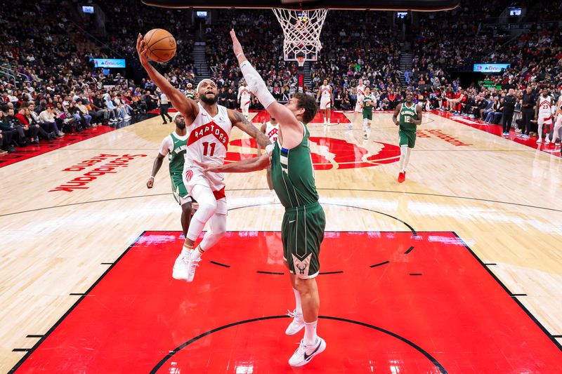 TORONTO, CANADA - JANUARY 6: Bruce Brown #11 of the Toronto Raptors drives to the basket during the game against the Milwaukee Bucks on January 6, 2025 at the Scotiabank Arena in Toronto, Ontario, Canada.  NOTE TO USER: User expressly acknowledges and agrees that, by downloading and or using this Photograph, user is consenting to the terms and conditions of the Getty Images License Agreement.  Mandatory Copyright Notice: Copyright 2025 NBAE (Photo by Vaughn Ridley/NBAE via Getty Images)